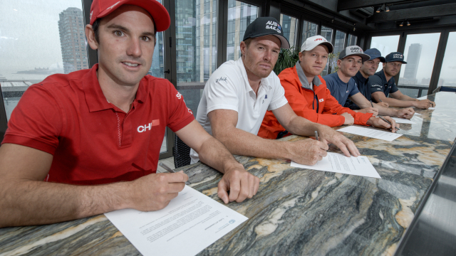 The helms from the six national SailGP Teams sign the UN Climate Change Sports for Climate Action fr